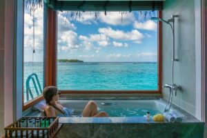 sheraton maldives review: overwater bungalow bathtub